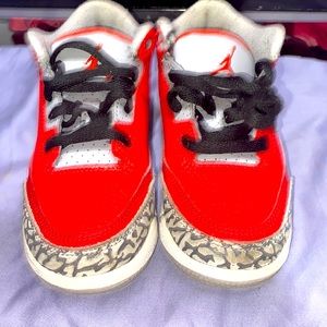 Red and gray Nike 4s